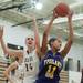 Ypsilanti's Cara Easley and Dexter's Emma Kill both go for a rebound  during their game, Friday Jan. 11.
Courtney Sacco I AnnArbor.com 